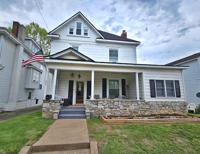 426 Duff Ave, Clarksburg, WV 26301 - american foursquare style home with a porch, a front lawn, a chimney, and stone siding