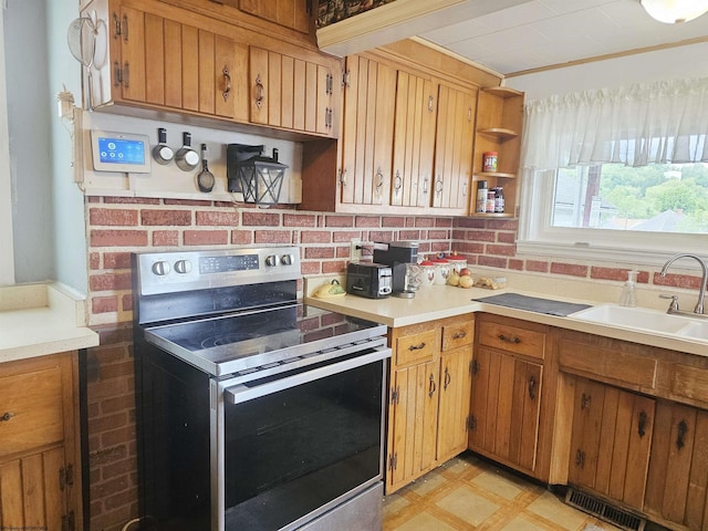 426 Duff Ave, Clarksburg, WV 26301 - kitchen featuring stainless steel electric range, a sink, light countertops, and brown cabinets