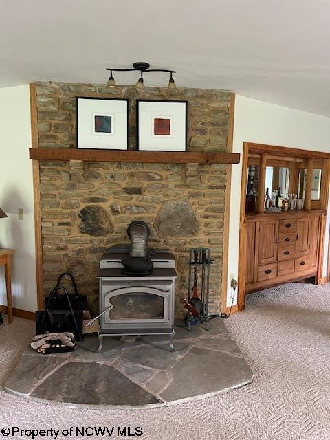 677 Dylan Rd, Elkins, WV 26241 - carpeted living room with baseboards and a wood stove