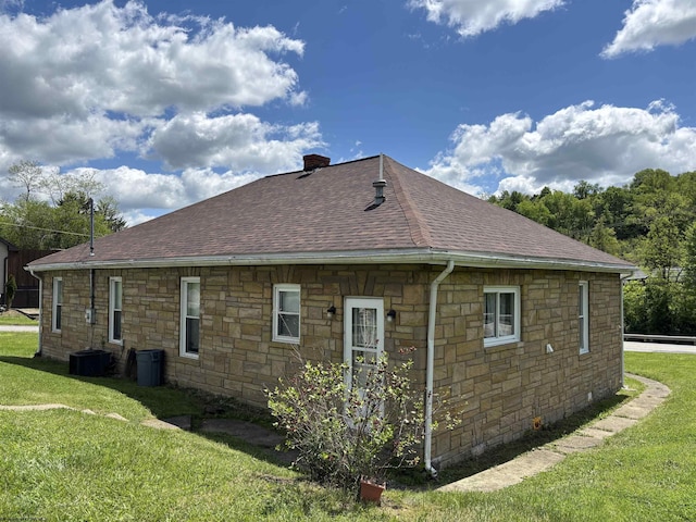 29 Dan St, Hepzibah, WV 26369 - view of property exterior featuring stone siding, a shingled roof, a lawn, and a chimney