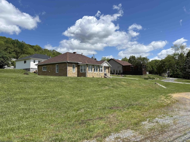 29 Dan St, Hepzibah, WV 26369 - view of property exterior featuring a yard and stone siding