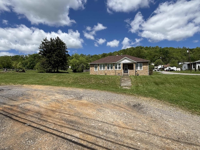 29 Dan St, Hepzibah, WV 26369 - view of front of property featuring a front lawn, dirt driveway, and stone siding