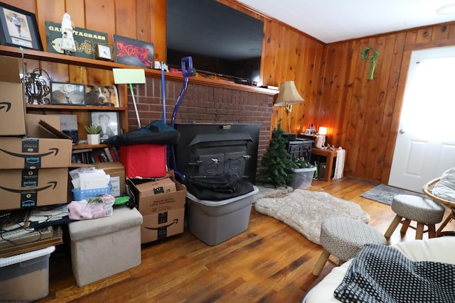 living room with wood finished floors and wooden walls