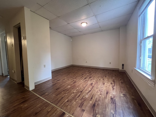 409 Forest Ave Unit 2, Morgantown, WV 26505 - empty room with wood finished floors, a paneled ceiling, plenty of natural light, and baseboards