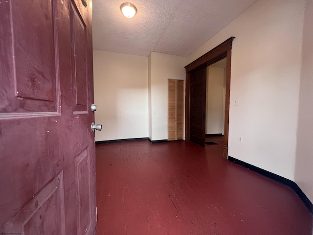 409 Forest Ave Unit 2, Morgantown, WV 26505 - unfurnished room with baseboards, a textured ceiling, and wood finished floors