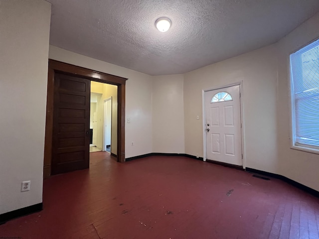 409 Forest Ave Unit 2, Morgantown, WV 26505 - foyer entrance with a textured ceiling, baseboards, and dark wood-style flooring