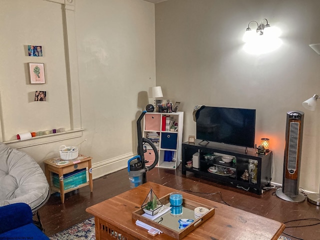 living area featuring wood finished floors and baseboards