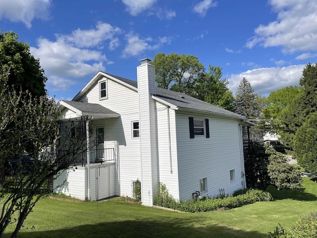 303 Morgantown St, Kingwood, WV 26537 - view of side of property featuring a yard, a chimney, and roof with shingles