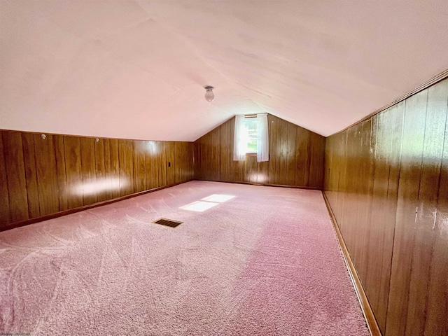 303 Morgantown St, Kingwood, WV 26537 - bonus room with lofted ceiling, wood walls, and carpet