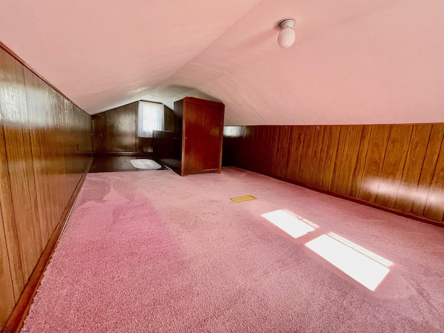 303 Morgantown St, Kingwood, WV 26537 - additional living space featuring wood walls, lofted ceiling, and light colored carpet