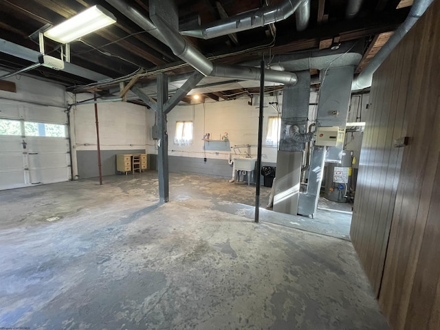 303 Morgantown St, Kingwood, WV 26537 - garage featuring gas water heater and a sink