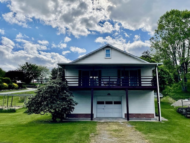 303 Morgantown St, Kingwood, WV 26537 - rear view of house featuring dirt driveway, a lawn, a balcony, and a garage