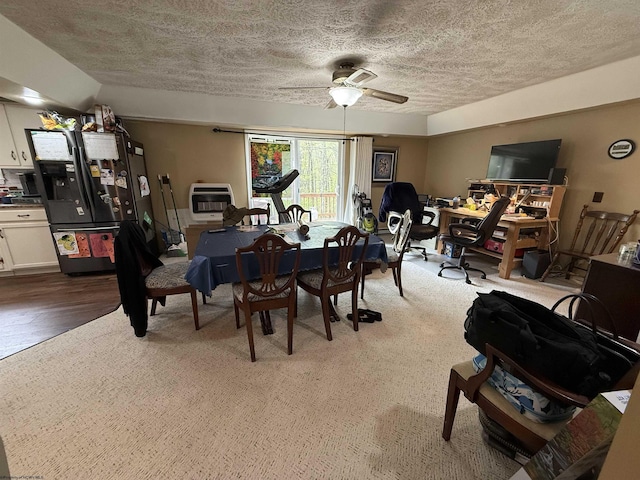 4253 Point Mountain Rd, Monterville, WV 26282 - dining space featuring heating unit, a textured ceiling, a ceiling fan, and wood finished floors