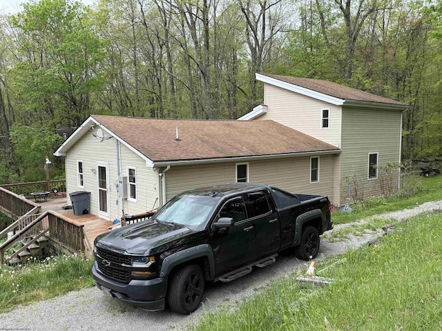 4253 Point Mountain Rd, Monterville, WV 26282 - view of property exterior with a wooden deck, a shingled roof, and a wooded view