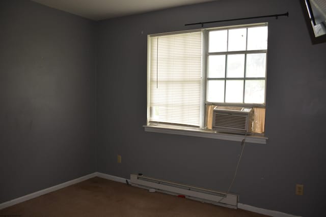 carpeted spare room featuring baseboard heating, baseboards, and cooling unit