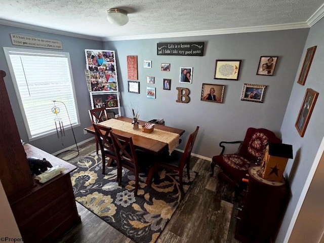 dining space featuring wood finished floors, ornamental molding, a textured ceiling, and baseboards