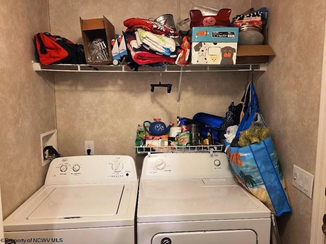 clothes washing area featuring washing machine and dryer