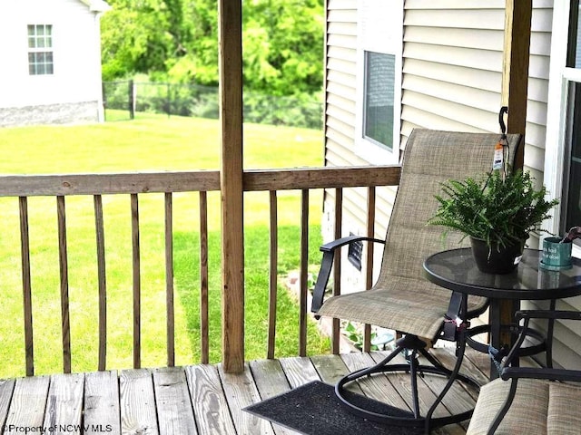 view of wooden balcony with a deck