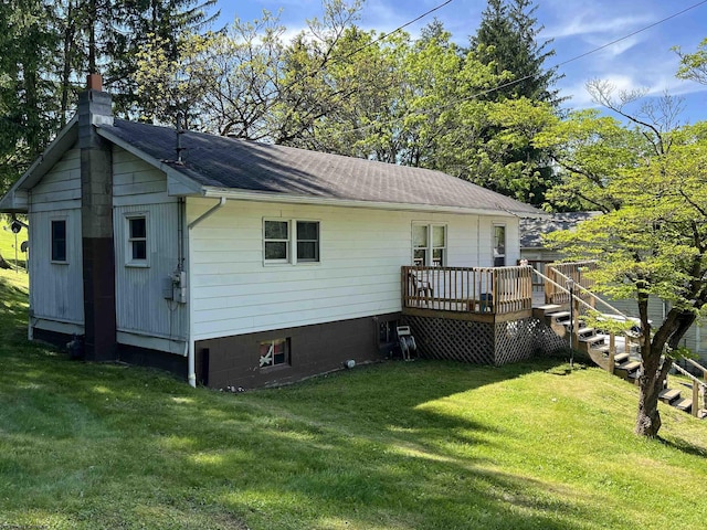 302 Jameson Ave, Parsons, WV 26287 - back of property with a chimney, a wooden deck, a yard, and roof with shingles