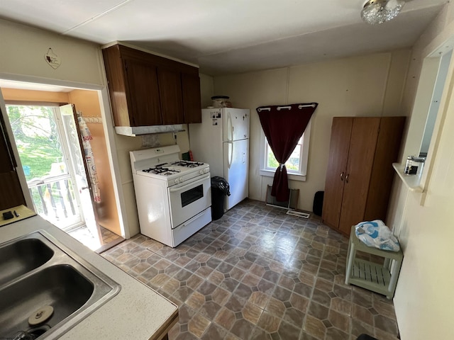 302 Jameson Ave, Parsons, WV 26287 - kitchen featuring white appliances, a sink, stone finish flooring, and healthy amount of natural light