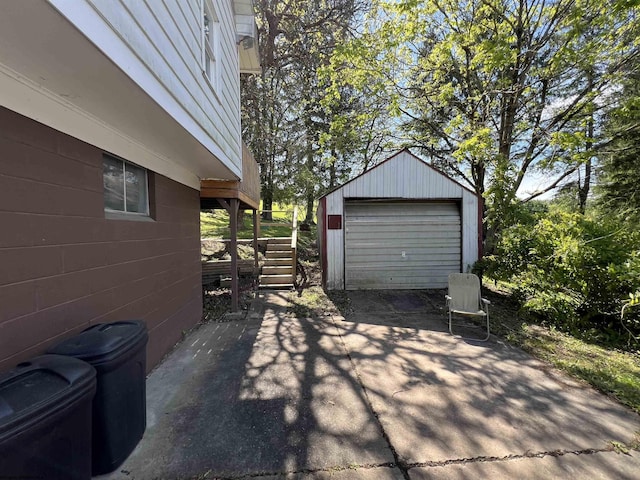 302 Jameson Ave, Parsons, WV 26287 - view of patio with concrete driveway, an outdoor structure, and a garage