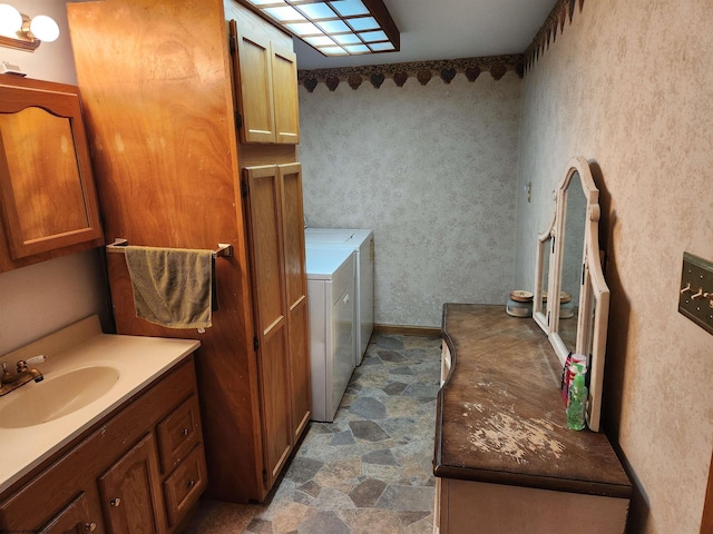 784 Ona St, Grafton, WV 26354 - bathroom featuring washer and clothes dryer, stone finish flooring, and vanity