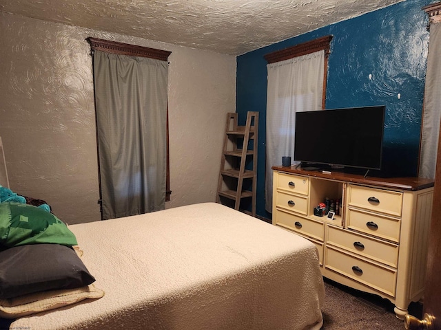 784 Ona St, Grafton, WV 26354 - bedroom featuring a textured wall, a textured ceiling, and dark colored carpet