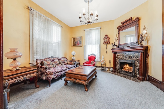 carpeted living room with a chandelier, a tile fireplace, and a baseboard heating unit