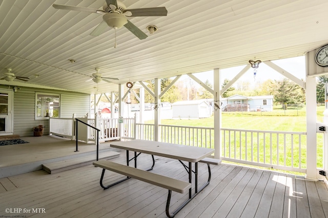 22 N Euclid Ave, Thomas, WV 26292 - deck featuring ceiling fan, an outbuilding, a yard, and a storage shed
