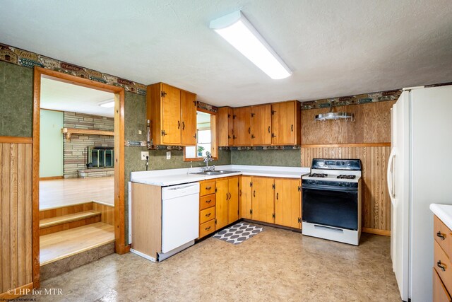 22 N Euclid Ave, Thomas, WV 26292 - kitchen with white appliances, light countertops, a sink, light flooring, and wood walls