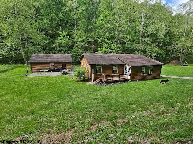 760 Skelton Run, Wallace, WV 26448 - view of front of home with a deck, a wooded view, and a front yard