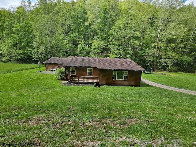 760 Skelton Run, Wallace, WV 26448 - view of front of house with a front yard, a wooden deck, and a forest view