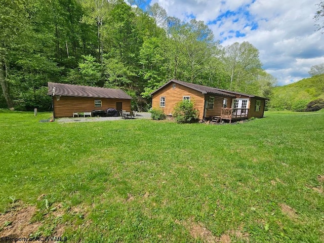 760 Skelton Run, Wallace, WV 26448 - view of green lawn with a wooden deck
