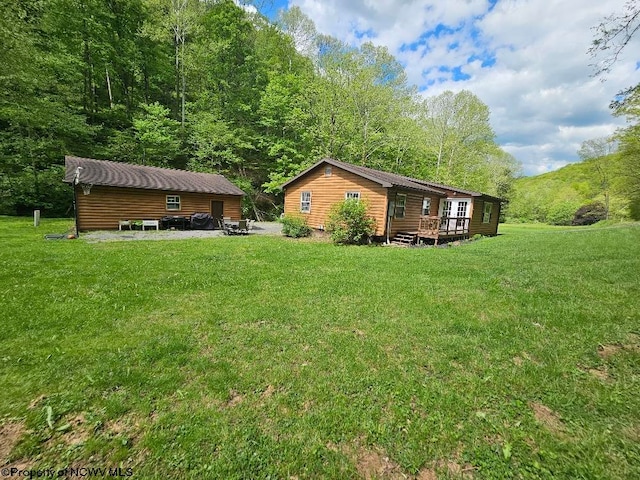 760 Skelton Run, Wallace, WV 26448 - view of grassy yard with a deck and a forest view