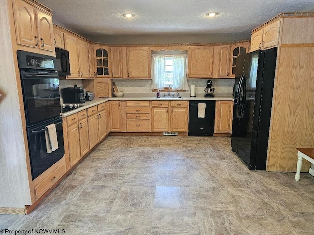 760 Skelton Run, Wallace, WV 26448 - kitchen featuring black appliances, a sink, glass insert cabinets, light countertops, and a textured ceiling