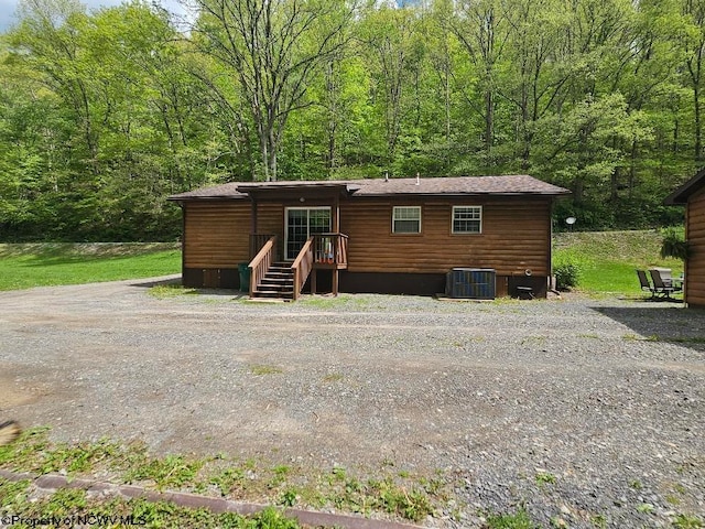 760 Skelton Run, Wallace, WV 26448 - view of front facade featuring central AC unit and a view of trees