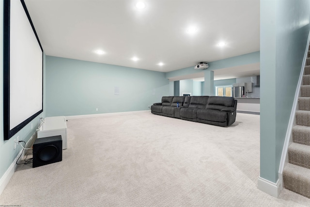 carpeted living area with stairs, baseboards, and recessed lighting