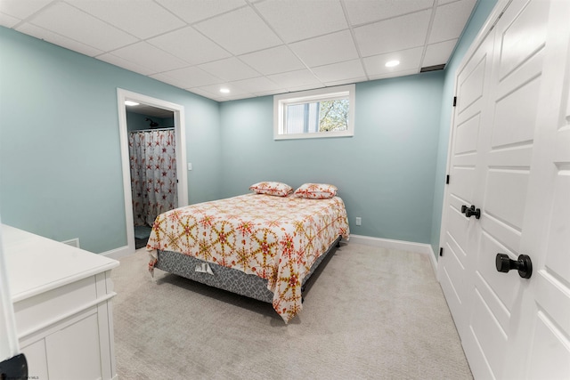 bedroom featuring light carpet, a paneled ceiling, baseboards, and recessed lighting