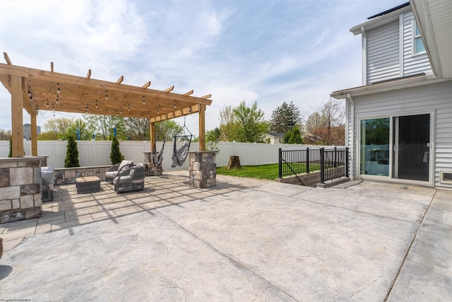 view of patio with a fire pit, a pergola, and a fenced backyard