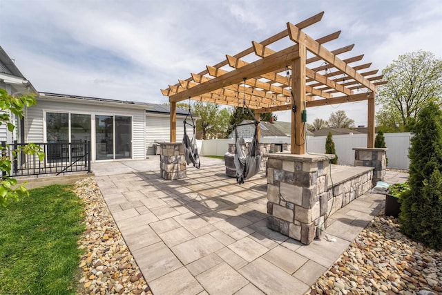 view of patio / terrace featuring a fenced backyard and a pergola