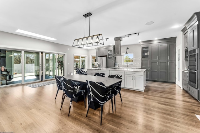 dining space with light wood-style flooring