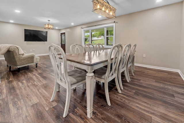 dining area featuring a chandelier, wood finished floors, baseboards, and recessed lighting