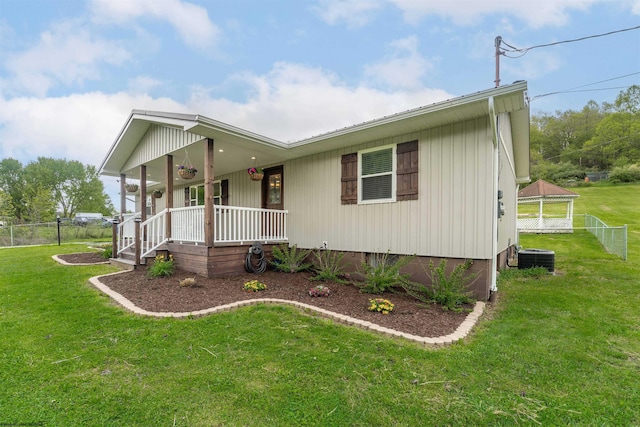 view of front of home featuring covered porch, crawl space, and central air condition unit