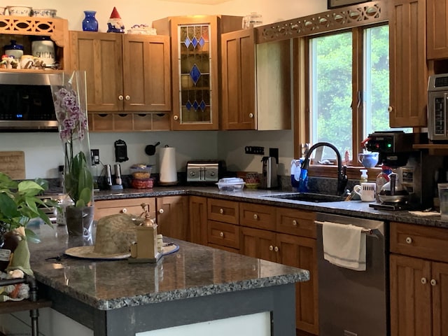 382 Knoll View Rd, Mount Clare, WV 26408 - kitchen featuring dishwasher, a sink, brown cabinets, and glass insert cabinets