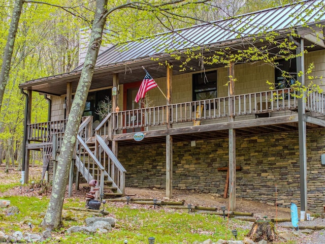 247 Daylily Ct, Terra Alta, WV 26764 - view of property exterior featuring metal roof, a standing seam roof, stairs, and stone siding