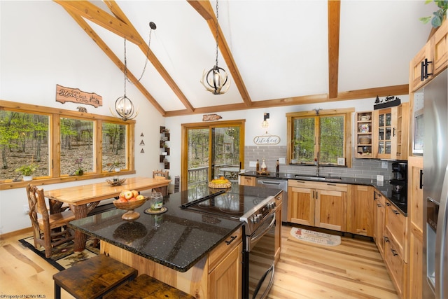 247 Daylily Ct, Terra Alta, WV 26764 - kitchen with appliances with stainless steel finishes, a sink, light wood-style flooring, beam ceiling, and a kitchen bar