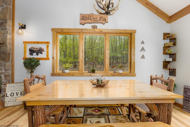 247 Daylily Ct, Terra Alta, WV 26764 - dining room with light wood-type flooring, vaulted ceiling, and a chandelier