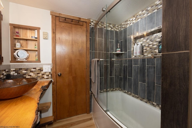 247 Daylily Ct, Terra Alta, WV 26764 - bathroom featuring shower / bath combination with glass door, wood finished floors, backsplash, and vanity