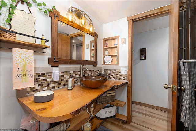 247 Daylily Ct, Terra Alta, WV 26764 - bathroom with decorative backsplash, wood finished floors, and a sink