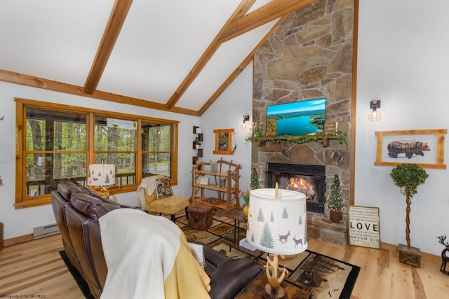 247 Daylily Ct, Terra Alta, WV 26764 - living area with a baseboard heating unit, wood finished floors, beam ceiling, a stone fireplace, and baseboards
